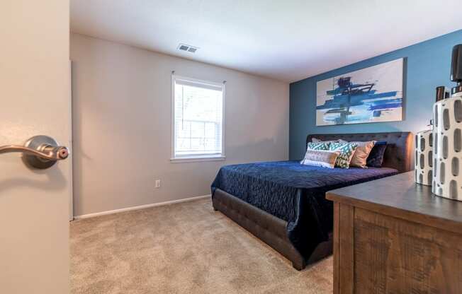 Bedroom at Ashton Brook Apartments with a large window