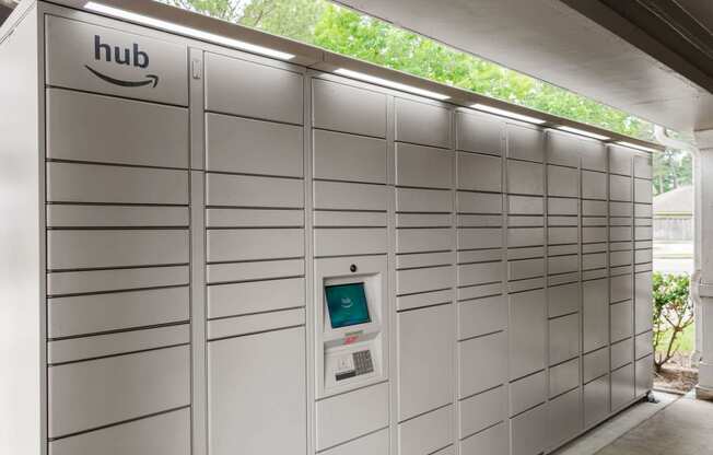 the automated parking meter is in the wall of a garage at Villages of Cypress Creek, Houston