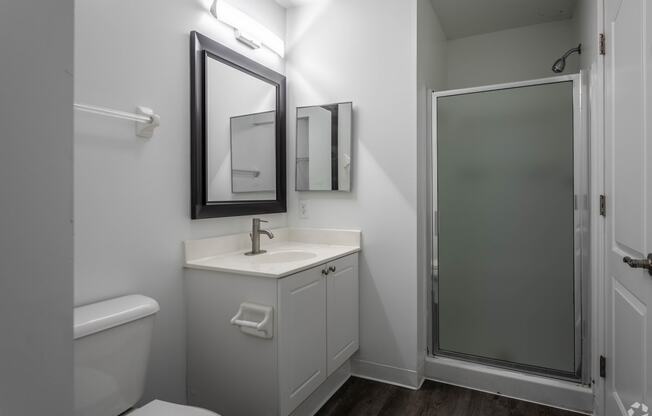 a small bathroom with a sink and a shower