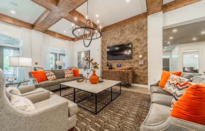 a living room with couches and chairs and a table