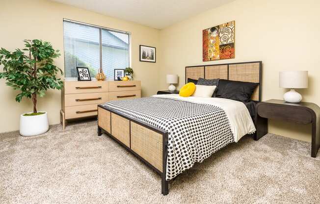 a bedroom with a bed and dresser Copper Ridge Apartments, Renton, 98055