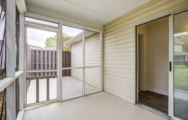 screened in patio with sliding glass doors