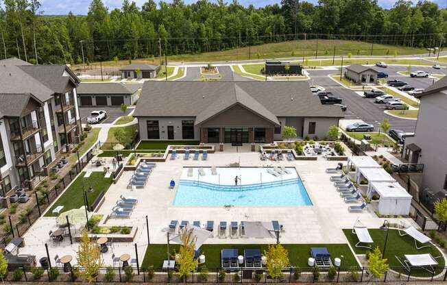 an aerial view of the pool at the resort on a sunny day