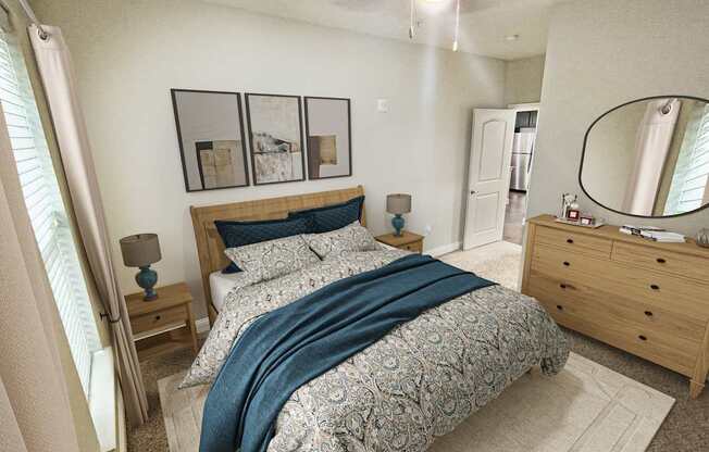 A bedroom with a bed, nightstand, and a dresser with a mirror.