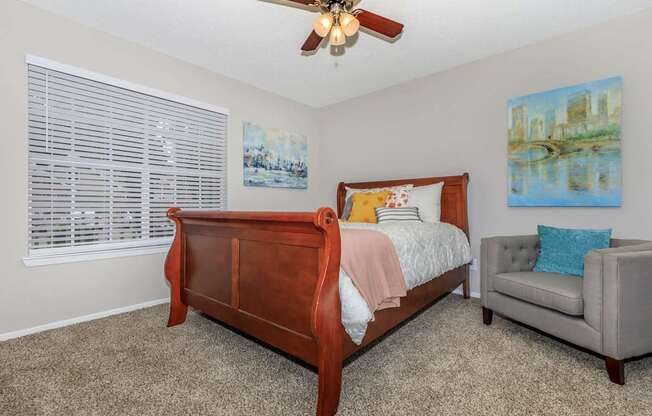 a bedroom with a bed and a ceiling fan at The Davis Apartments, Alabama, 35816