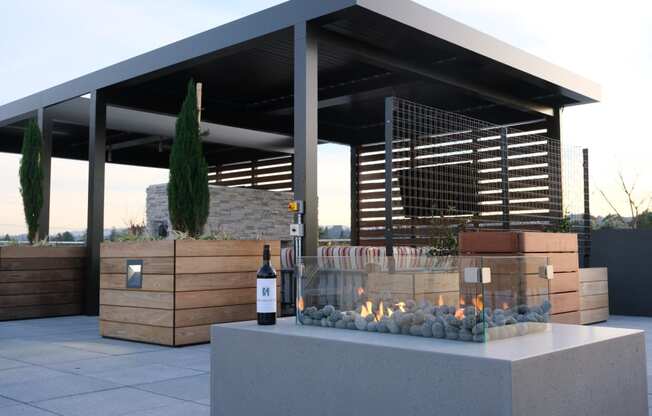 Lounge seating with fire pit at Bayswater Apartments, Burlingame, 94010