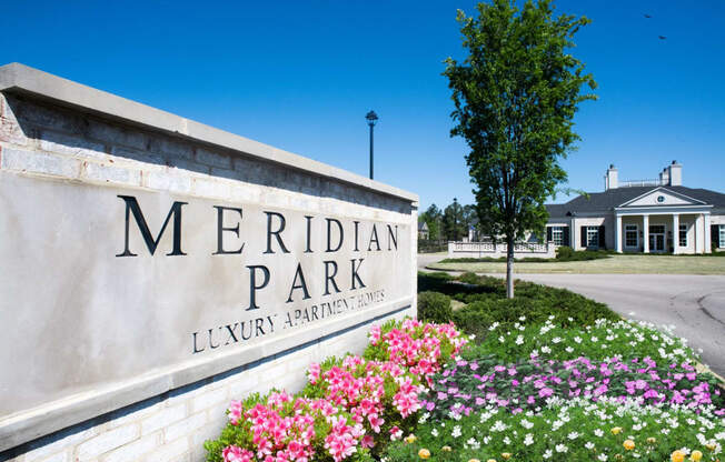 a sign that says meridian park with flowers in front of it, at Meridian Park Apartments, Collierville, Tennessee