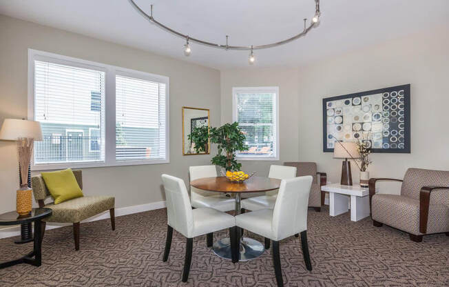 a dining room with a table and chairs