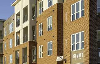 Exterior of four-story building with retail space available on the first floor