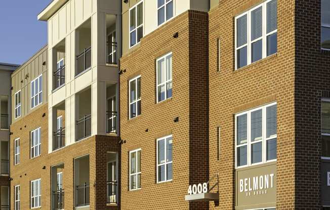 Exterior of four-story building with retail space available on the first floor