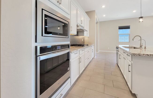 Just a year old in highly sought after GATED area of Goodyear!
