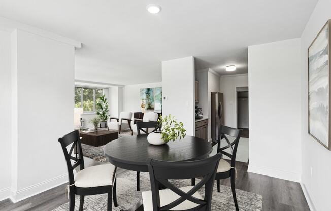 a dining room with a table and chairs