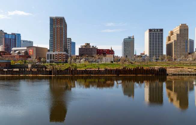 the city reflected in the water of a river at Dey & Bergen, Harrison, 07029