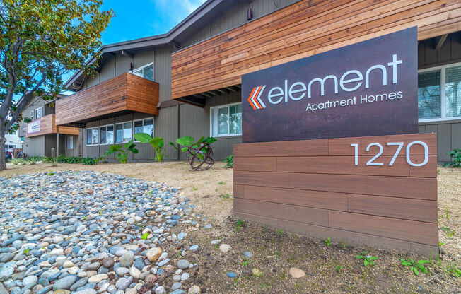 the front of an apartment building with a sign for lenient apartment homes at Element LLC, Sunnyvale, 94086