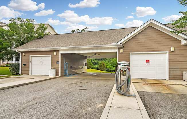 a gas pump sitting in front of a garage