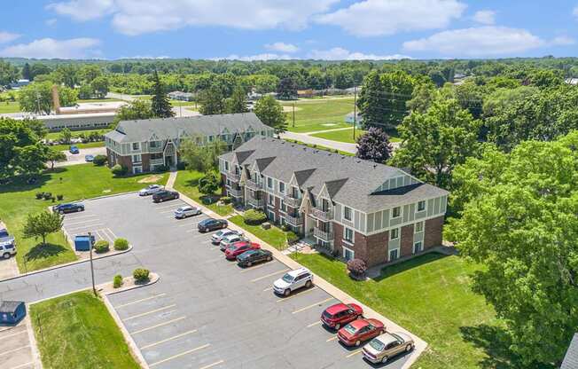 an aerial view with shade trees and green lawns at Briarwood Apartments, Benton Harbor, Michigan