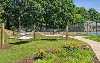 A playground with a swing set and a basketball court.
