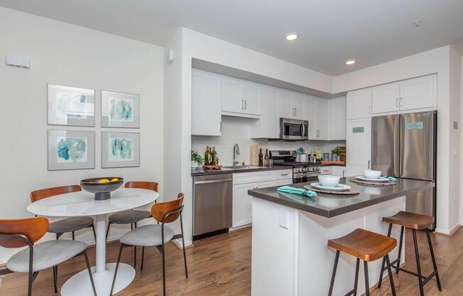 a kitchen with a dining room table