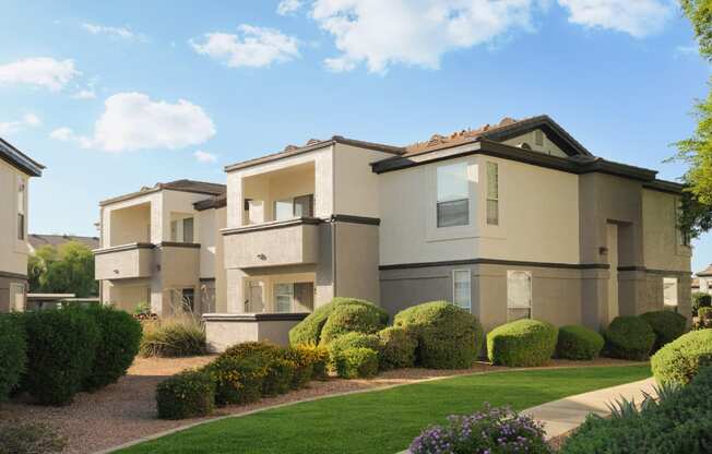 a render of a house in a yard with grass and bushes