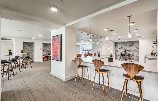 Clubroom Lounge and Dining Area with large kitchen with island and stainless steel appliances at arte apartments