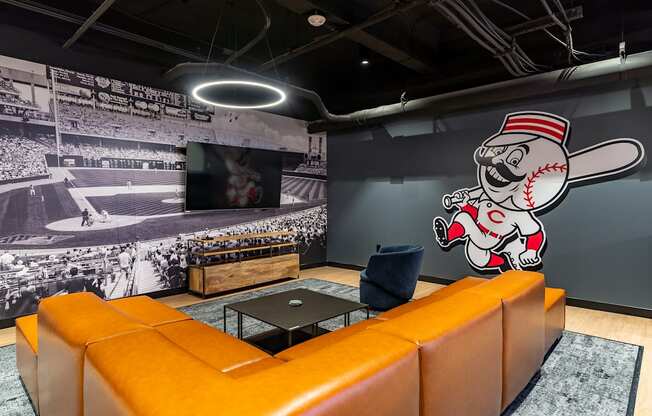 a wall mural of a baseball player in a living room