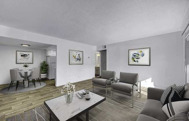 A living room with a grey couch and a coffee table.