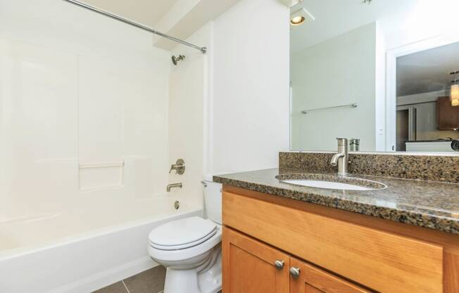 a bathroom with a sink toilet and a mirror  at Delano, Washington