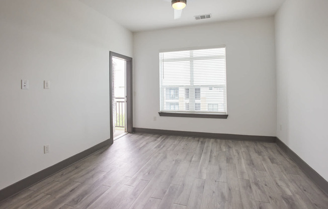 Living Room with Balcony and Hard Surface Flooring