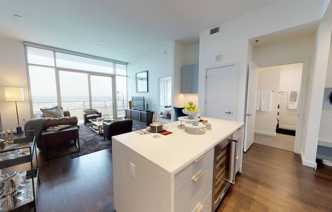 Kitchen island featuring storage and built in wine cooler