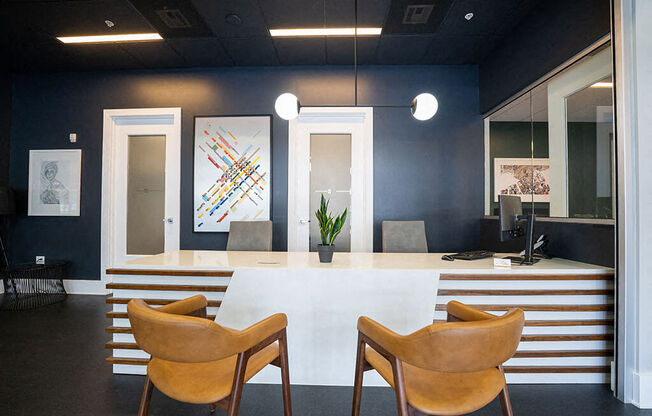 a conference room with a white table and chairs