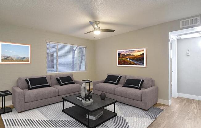 a living room with some chairs and a carpet