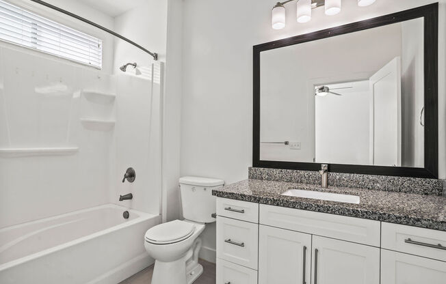 a bathroom with a sink toilet and a bath tub  at Aero Luxury Townhomes in Layton, Utah