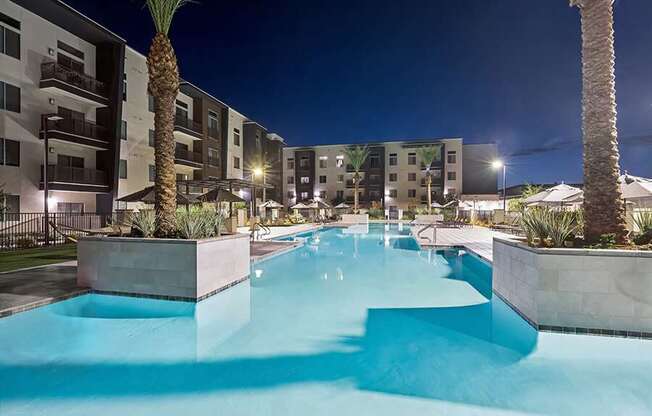 Community Swimming Pool with Pool Furniture at Glen 91 Apartments located in Glendale, AZ.
