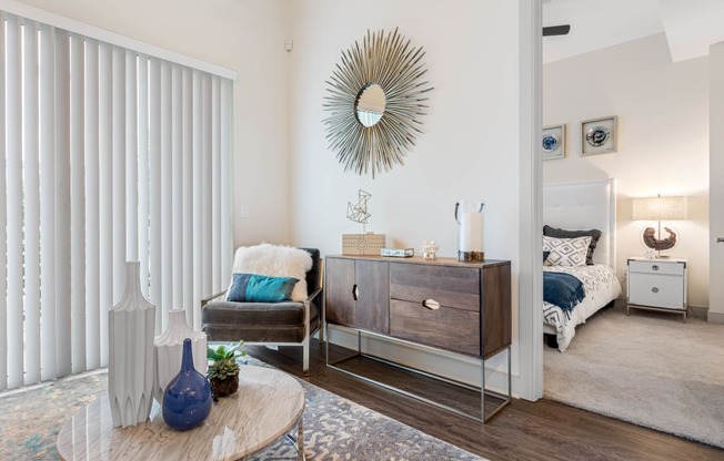 a living room with a couch and a dresser