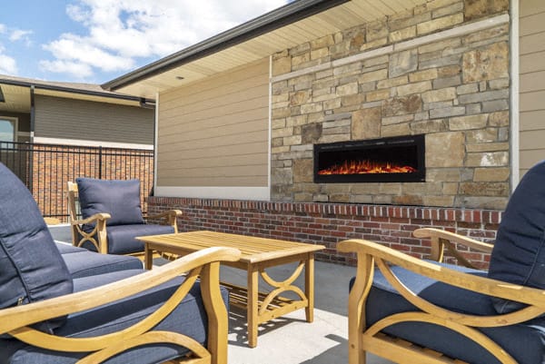 Outdoor fireplace and lounge at The Villas at Falling Waters townhomes for rent in West Omaha