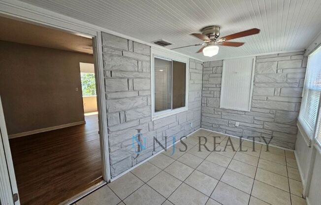 REDUCED $200!! Cute 3/1 with updated kitchen & bath, enclosed front lanai & one car garage!!