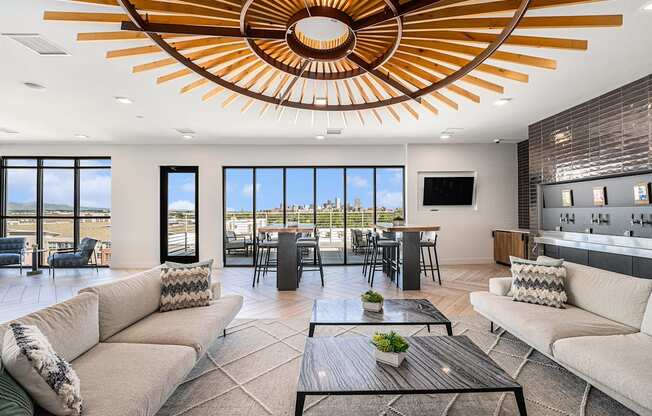 A modern living room with a large window overlooking the city.