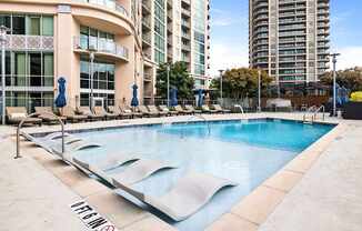 A pool with a no dive sign in front of a building.