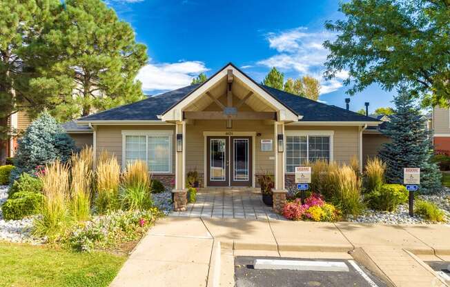 the front of a house with a driveway and a porch