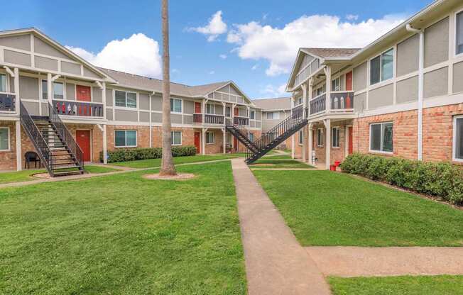 Lush Green Landscape at Castlewood Apartments, Clute, Texas