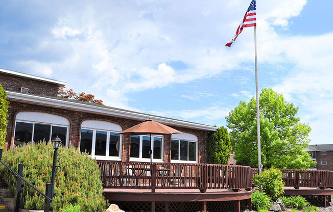 a building with an american flag in front of it