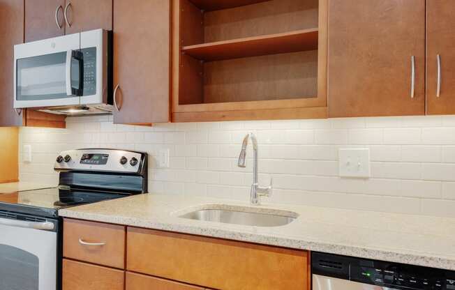 a kitchen with a sink and a microwave