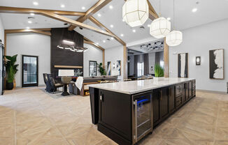 A modern kitchen with a large island and a dining area with a table and chairs at Madison Prickett Preserve, Yardley Pennsylvania