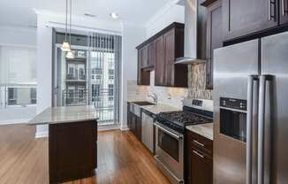 a kitchen with stainless steel appliances and a large island