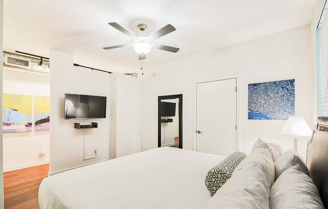 bedroom with a large bed and a ceiling fan
