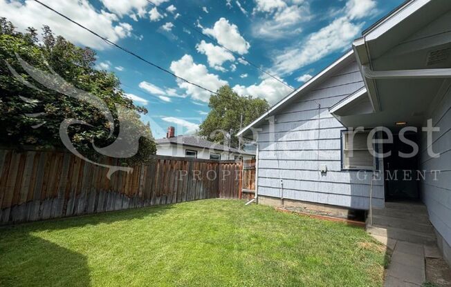 Three Bedroom, Two Bathroom House with Fenced Yard and Outdoor Fireplace