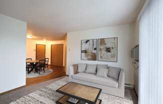 Fargo, ND Flagstone Apartments. a living room with a couch and a coffee table