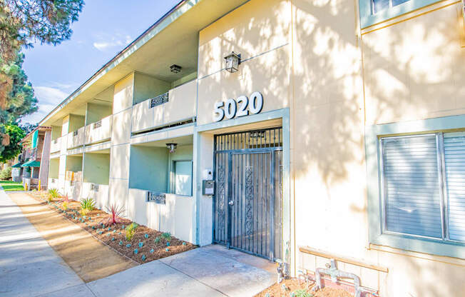 the entrance to an apartment building with a door