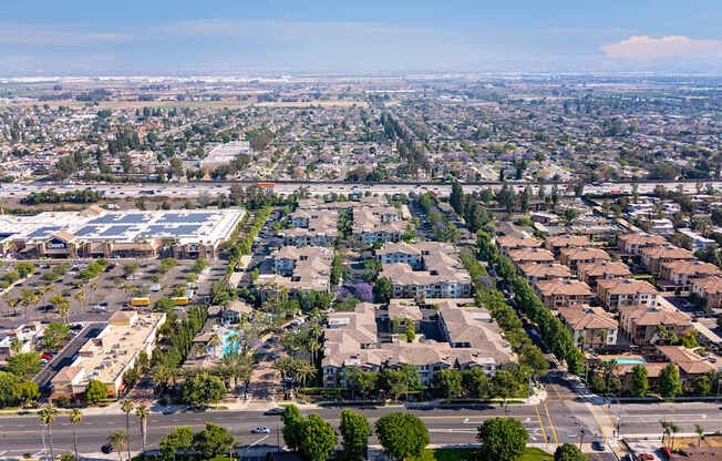 A bird's eye view of a residential area with houses and trees.