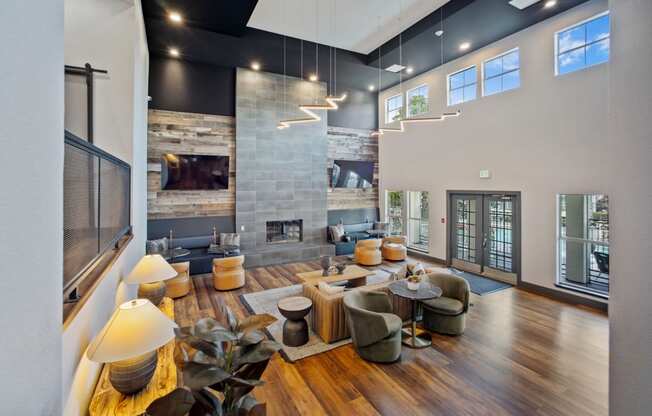 a living room with couches and chairs and a fireplace